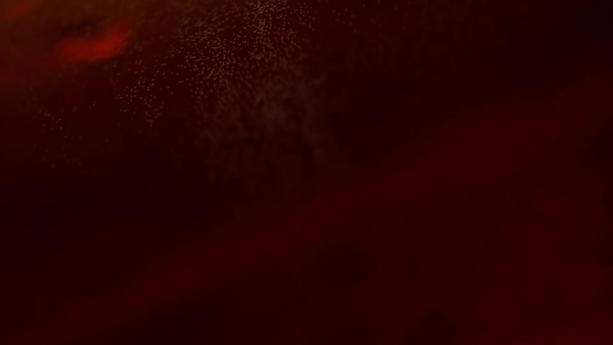 Particles and bubbles floating in a red liquid red light