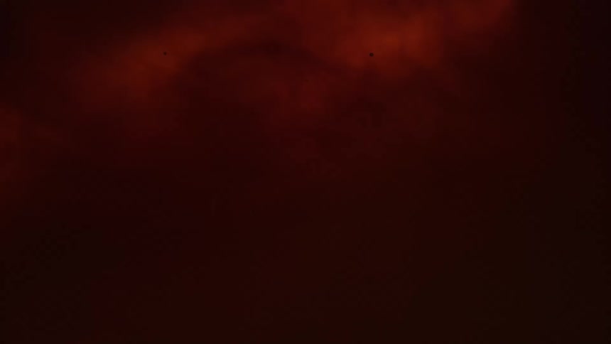 A light glows red under a thin membrane
