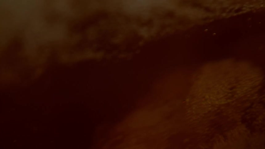 Abstract footage of bubbles rising in liquid