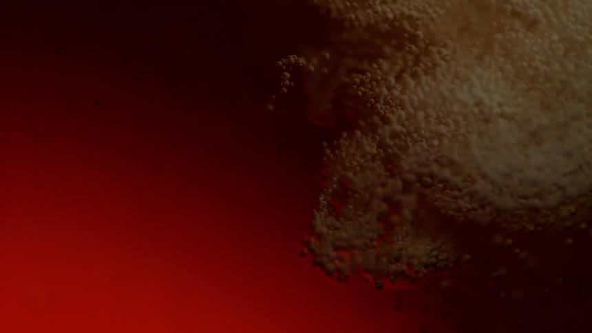 A liquid is poured and many bubbles escape