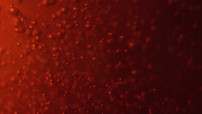 A brown liquid with bubbles