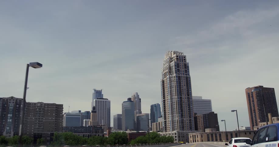 Cars are driving in a city