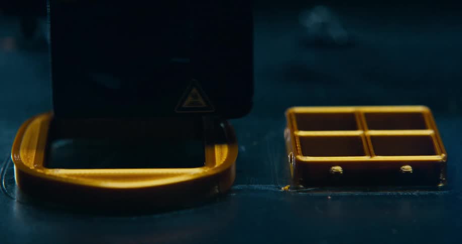 A machine is working on a device