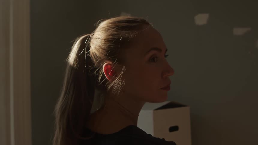 A woman is standing in a room
