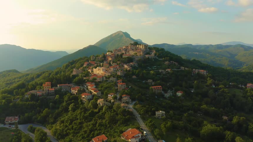 Aerial view of houses built on a hill golden hour