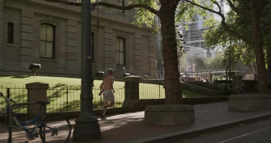 A man running down a city street