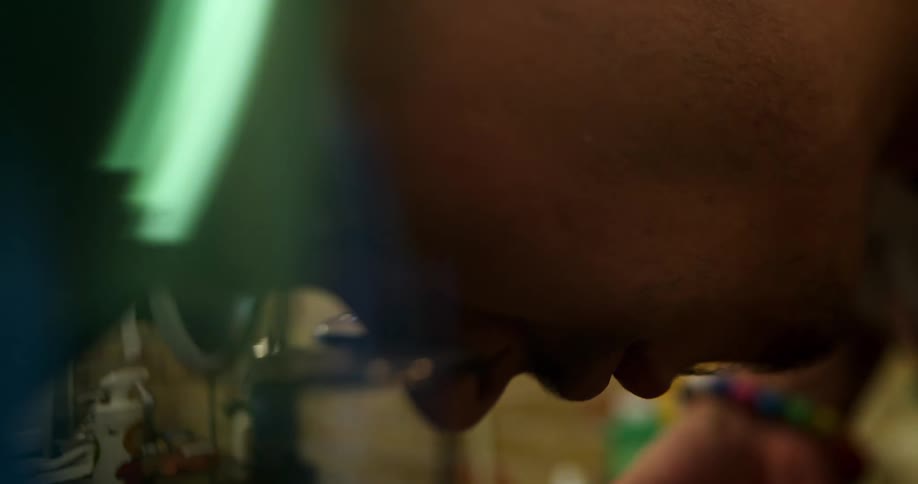 Close up of a man using scissors