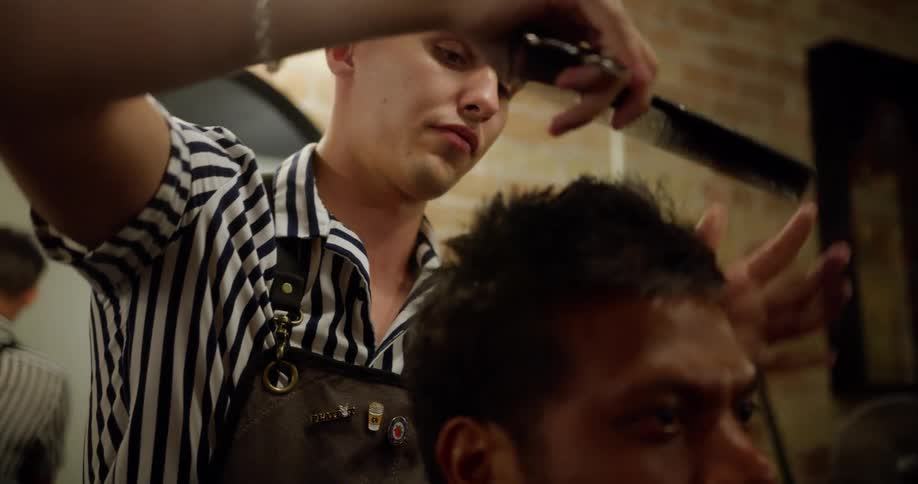 Barber cutting mans hair