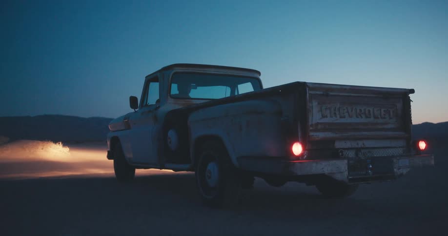 A man gets into his truck and drives off