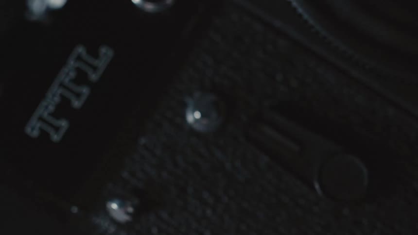 A camera with dials and letters