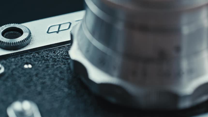 A close up of a metal knob with numbers on a camera
