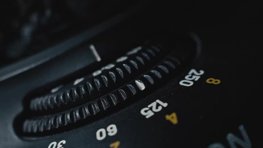 A camera with a dial with numbers and letters