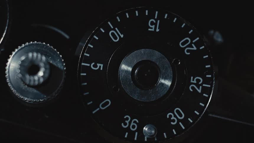 A rotating metal dial with numbers