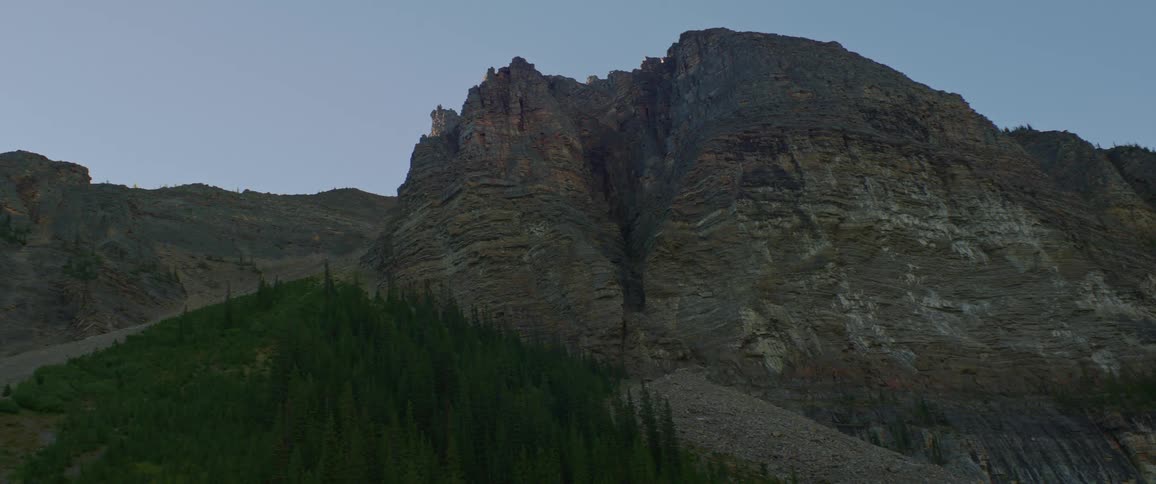 A rocky mountainside in the daytime