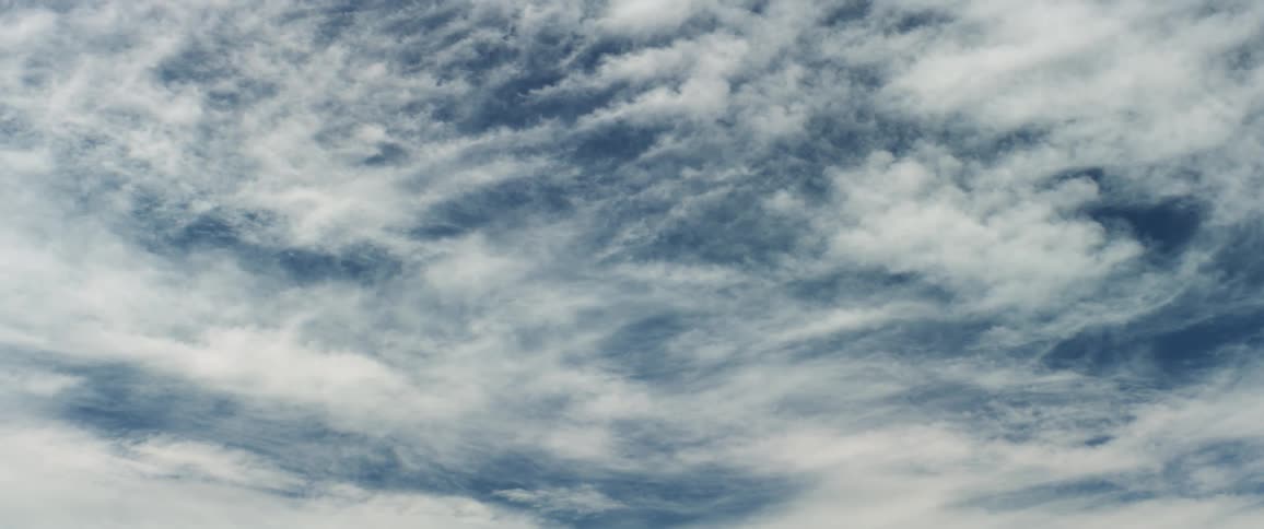 White clouds moving in the wind on a blue sky