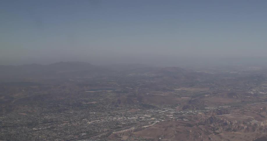 Aerial view of a valley near mountains