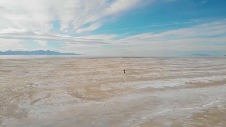 A person walking across the desert