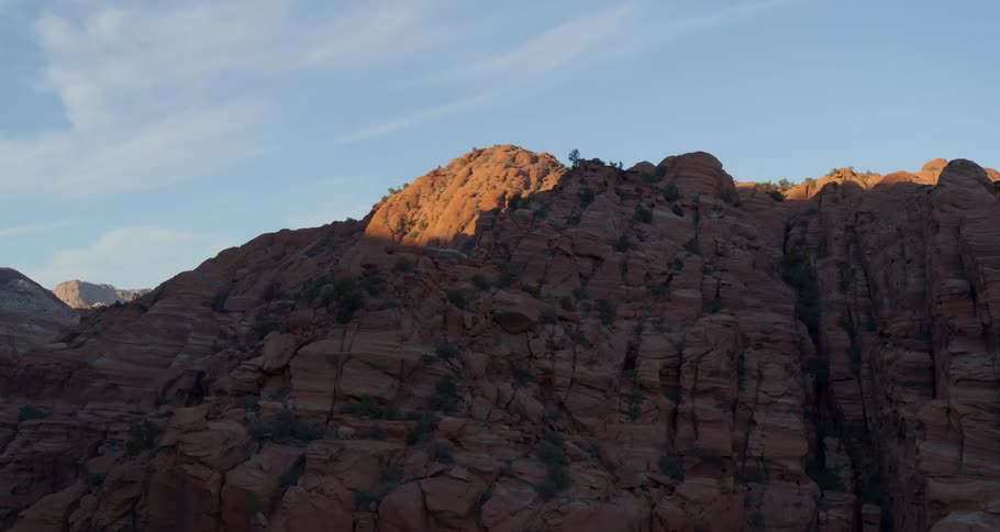 Brown mountainside against a clear blue sky