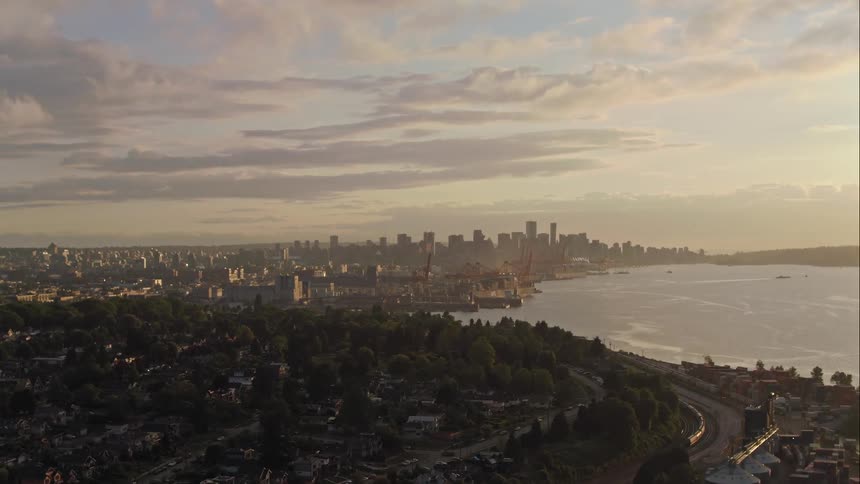 The sun sets behind downtown Vancouver