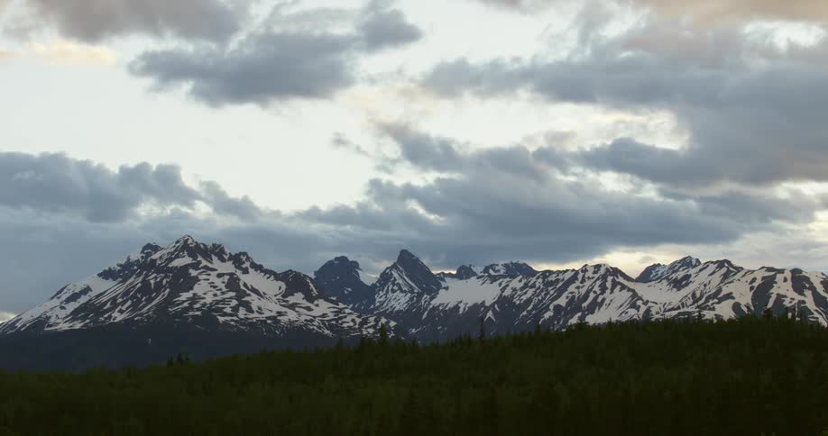 Clouds moving across a mountain range