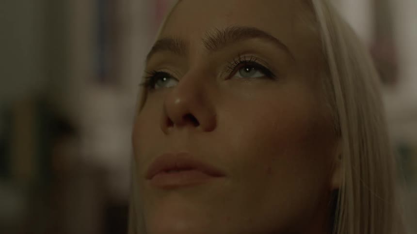 Close up of a woman's face as she looks up