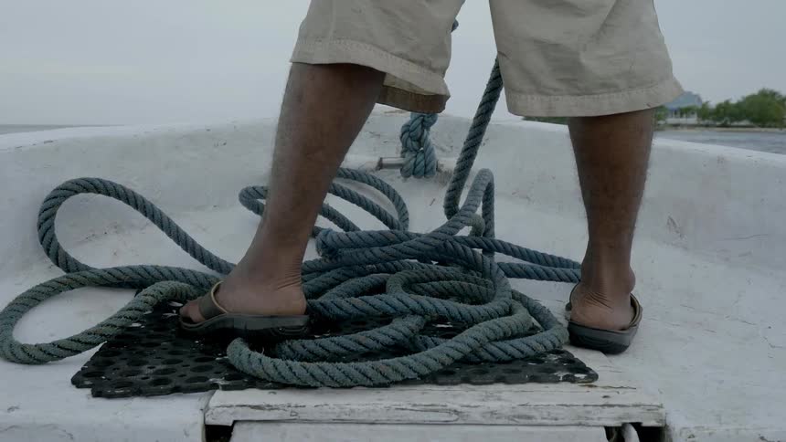 A man is sailing in a small boat