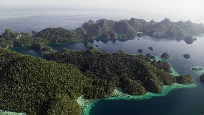 Aerial view of islands are displayed by the ocean
