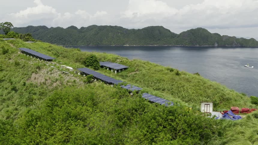 Small remote controlled aircraft taking flight next to a cliff on an island