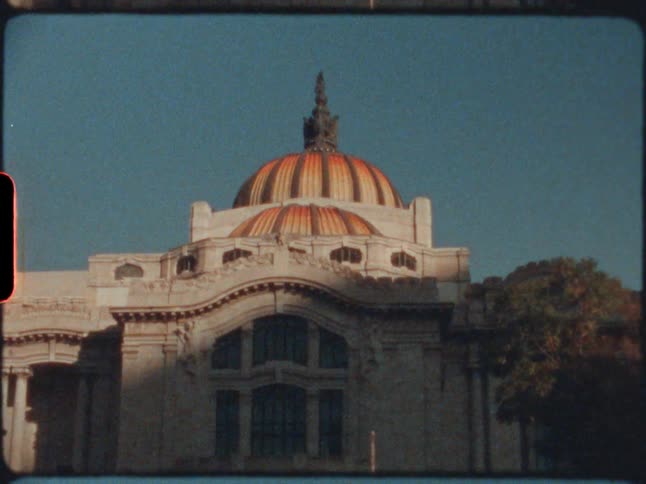 A large domed building under a clear daytime sky