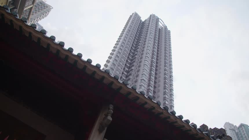 Buildings in a city is displayed during the day