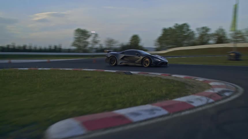 A car is racing on a track in spring