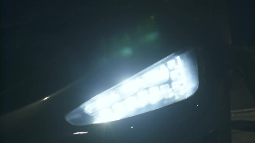 Bright headlight on a parked car