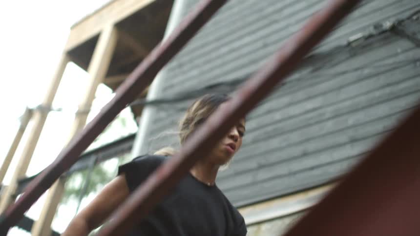 A woman is exercising on stairs