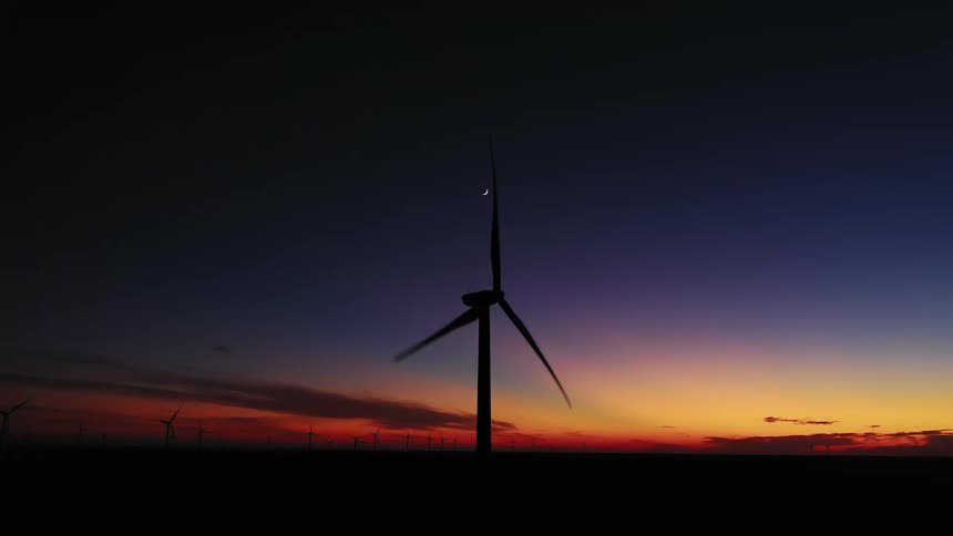 A windmill is moving in the sky