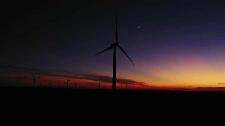 Wind turbines with a setting sun