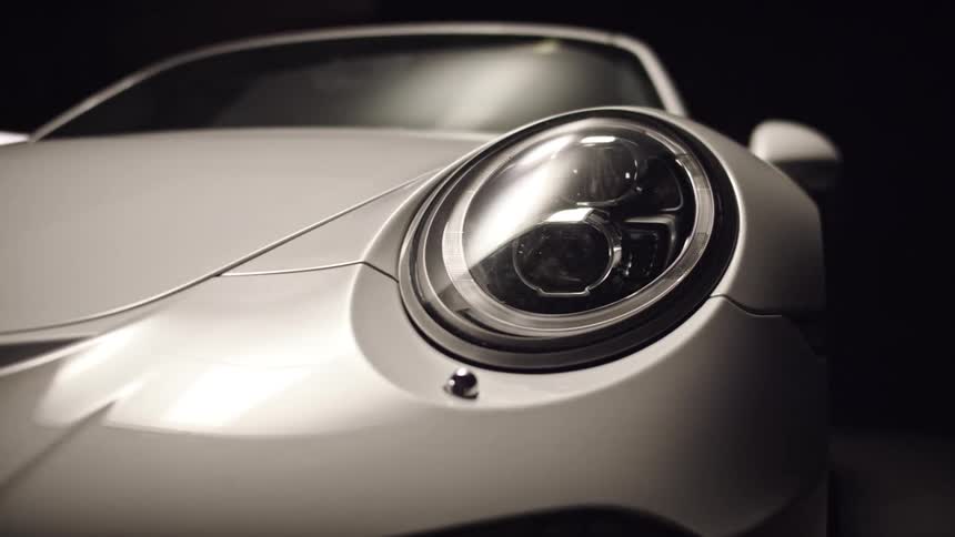 A silver car is on display