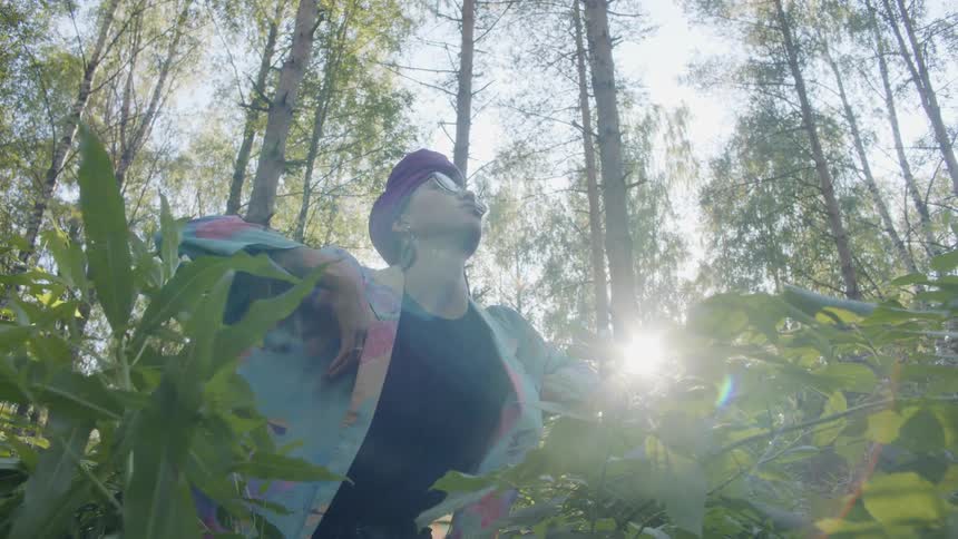 Woman practicing relaxation technique while in a forest