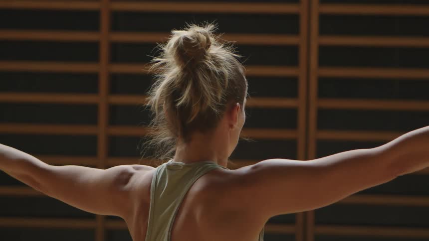A woman stretches during exercise