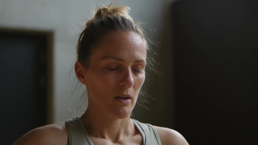 Woman with closed eyes thinking deeply