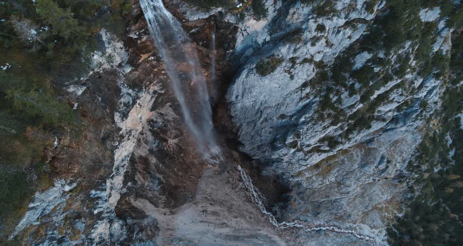 A water fall crashing over a cliff