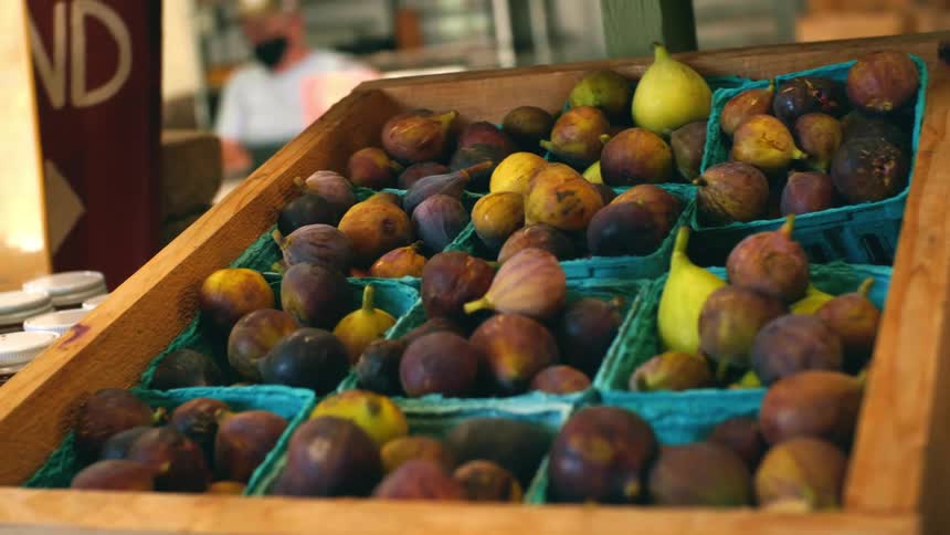 Pears are on display for sale outside a shop during the day
