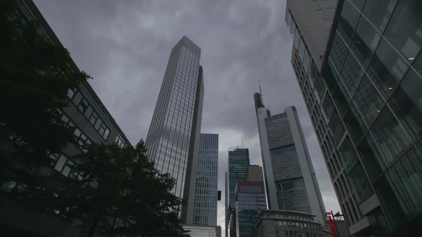Downtown from street level and up with buildings and an overcast sky