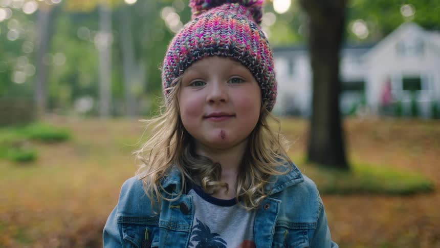 Young child smiling at camera