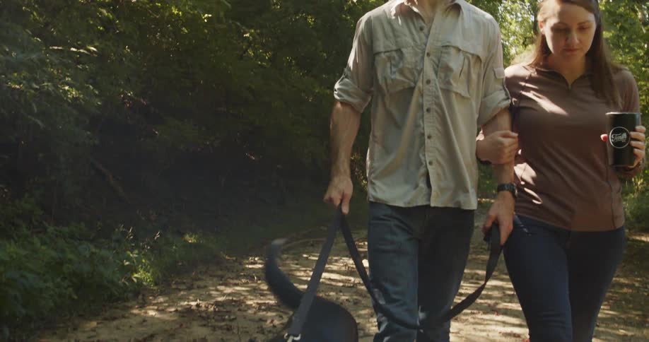 Couple walking their dog