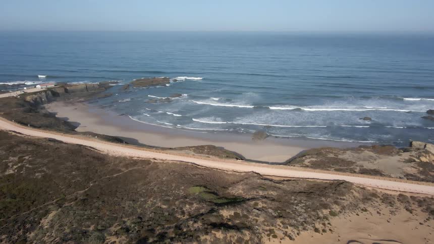 Waves crash in the ocean and on the beach