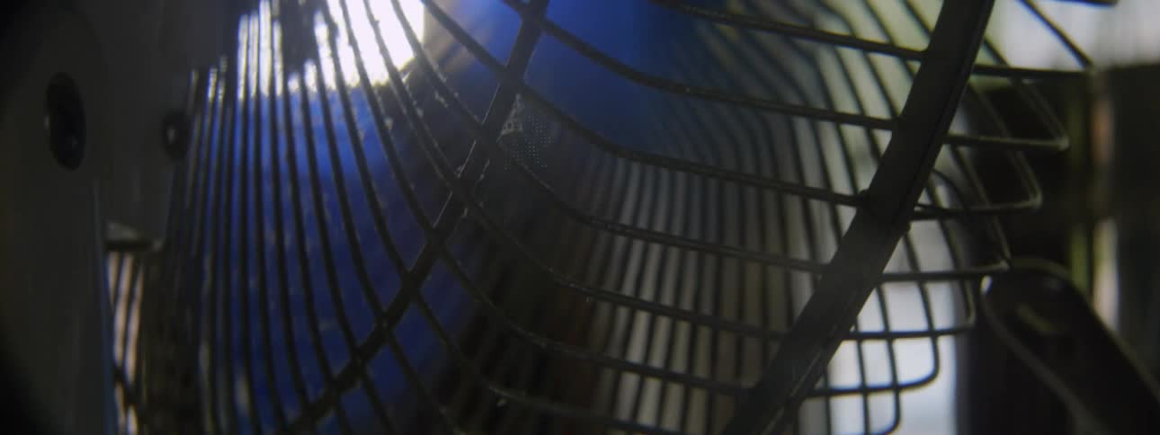 A fans blades begin to spin