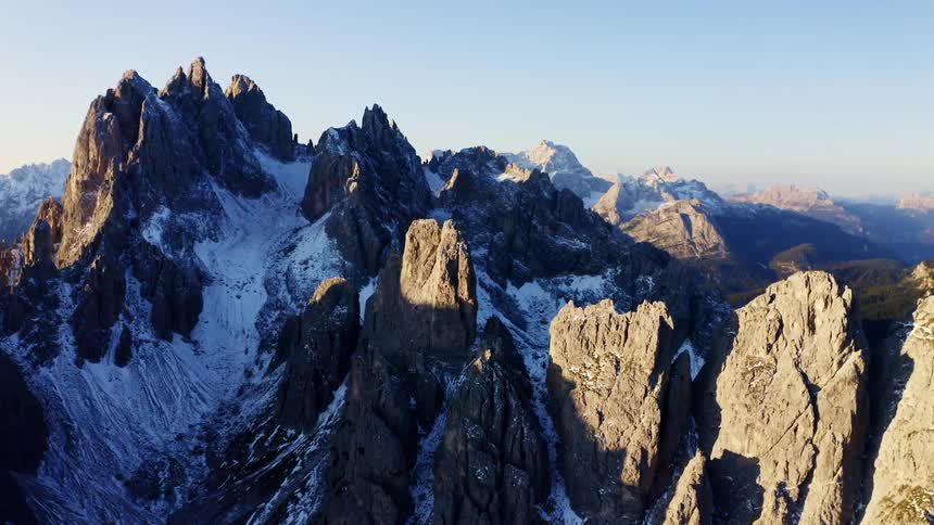 Snow covered mountain peaks on a clear day