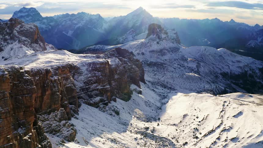 Mesa and snow covered canyon with mountains