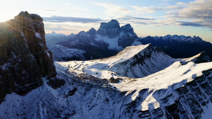 Mountain landscape with snow in bright sunlight