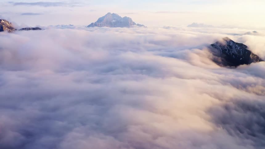 Clouds move around mountain tops